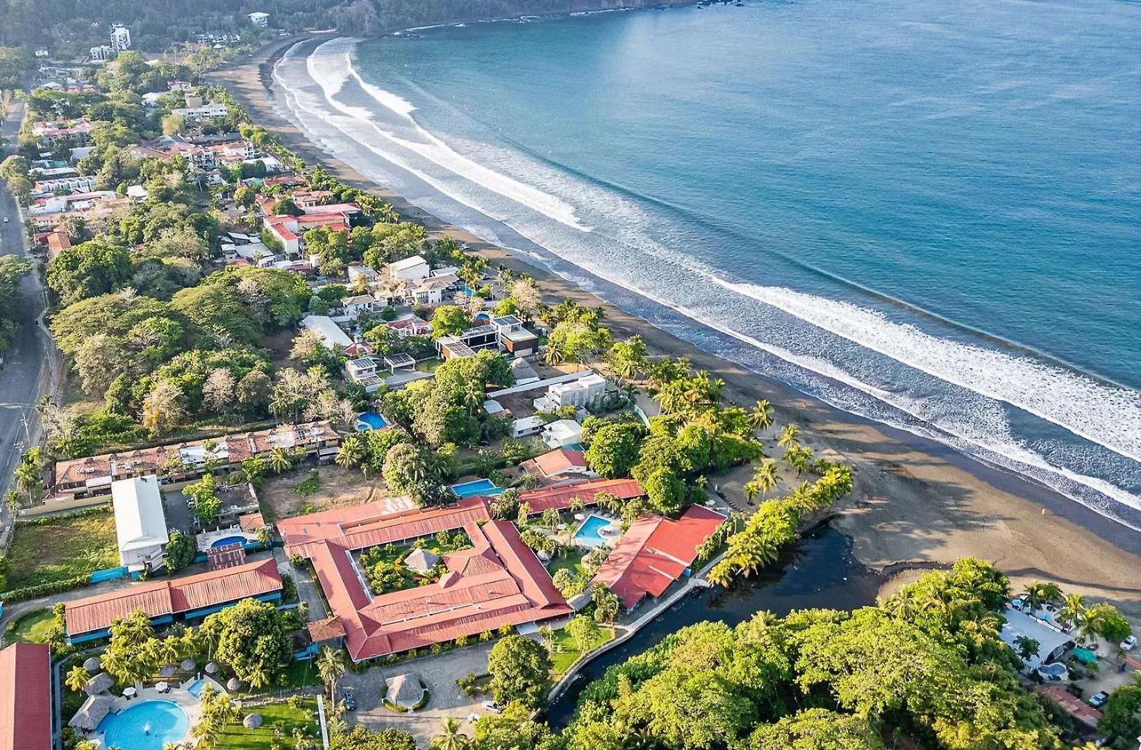 Aerial view of Jaco Beachfront villas and ocean during the Costa Rica off season
